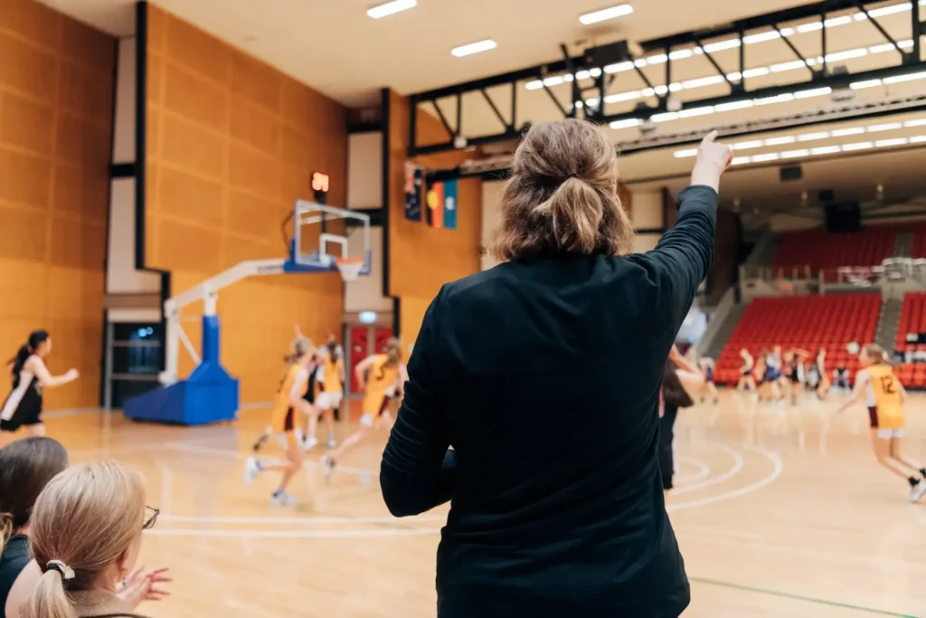 Lady coaching a basketball game