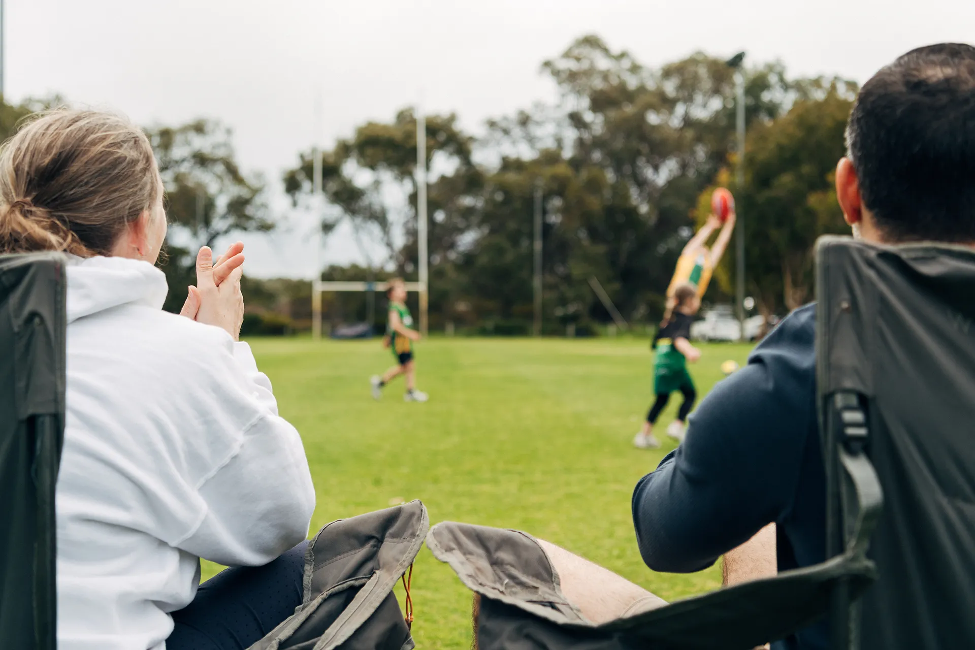 Spectators watch game of football